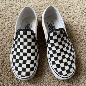 Vans checkered slip ons.